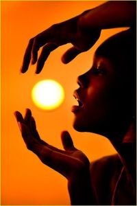 Silhouette Holding Sunset