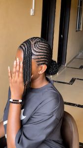 Curved Cornrow Bun with Curls